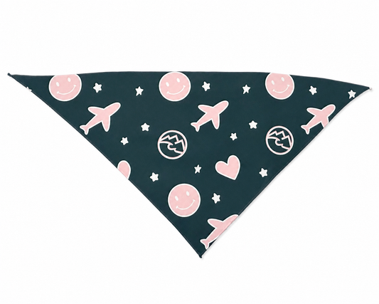 Dark green with pink and white pattern of smiley faces, airplanes, stars, hearts, and Unrefined Friends logo triangular pet bandana for dogs.